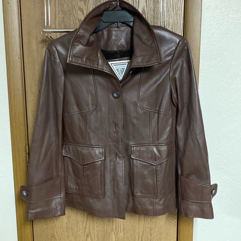 Women’s dark brown leather coat with velvet lining.